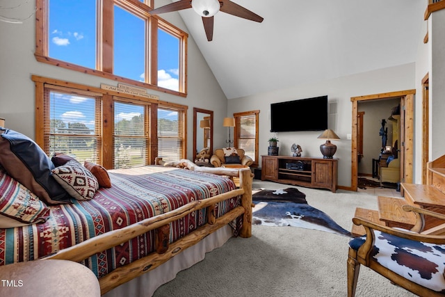 carpeted bedroom with high vaulted ceiling and a ceiling fan
