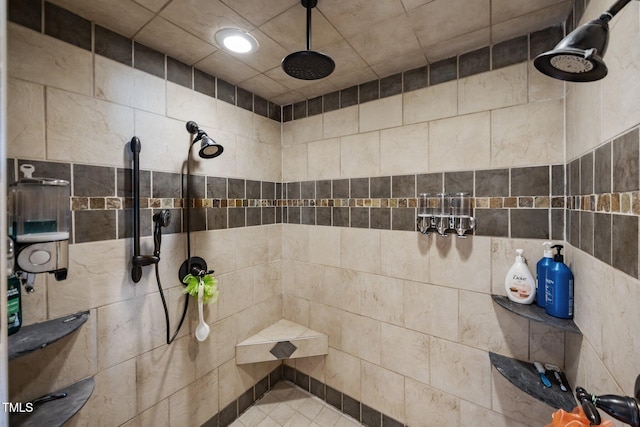 bathroom with a tile shower