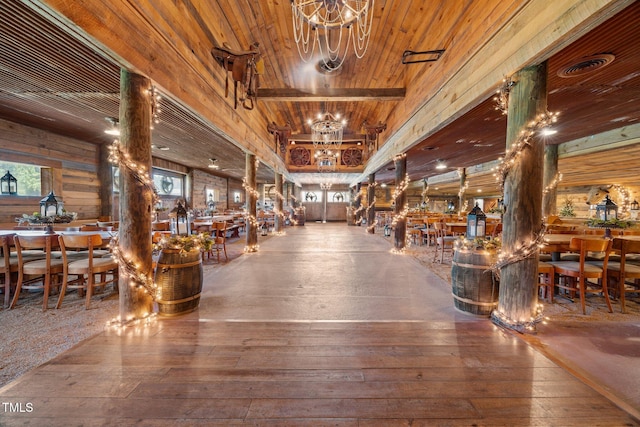 building lobby featuring wooden walls and wooden ceiling