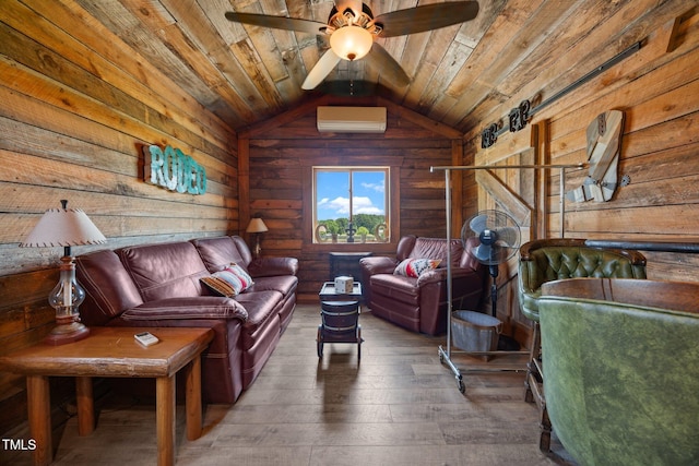 living area with wood walls, a wall unit AC, wood ceiling, hardwood / wood-style flooring, and vaulted ceiling