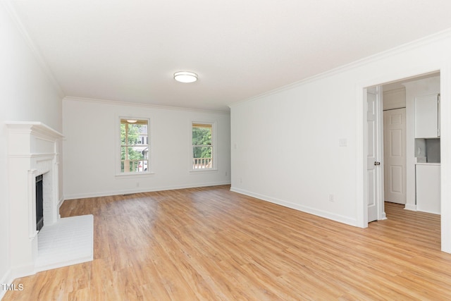 5429 Fortunes Ridge Dr, Durham, NC 27713 - unfurnished living room featuring crown molding, light wood finished floors, and a fireplace