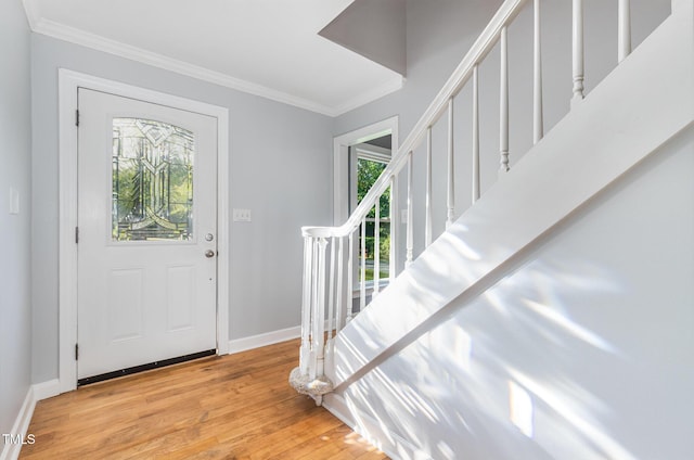 5900 Holly Dr, Raleigh, NC 27616 - foyer entrance with crown molding, light wood-style floors, and stairs