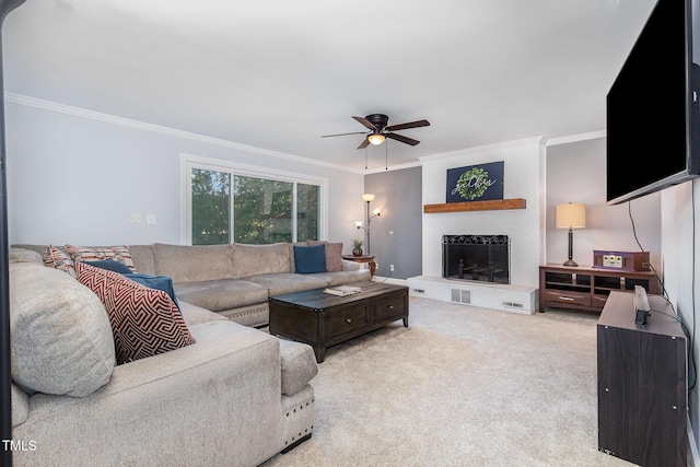 5900 Holly Dr, Raleigh, NC 27616 - carpeted living area featuring crown molding, a ceiling fan, and a fireplace