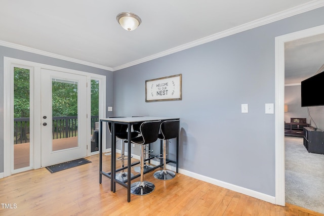 5900 Holly Dr, Raleigh, NC 27616 - dining area featuring crown molding and light wood-type flooring