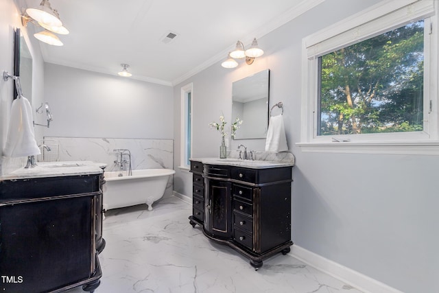 5900 Holly Dr, Raleigh, NC 27616 - full bathroom featuring marble look tile flooring, two vanities, a soaking tub, and ornamental molding