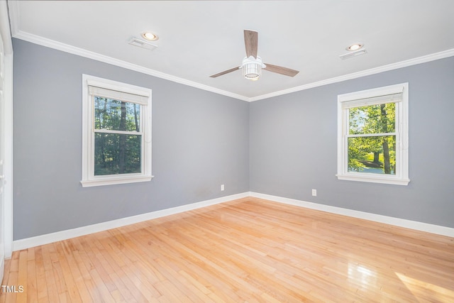 5900 Holly Dr, Raleigh, NC 27616 - spare room featuring light wood-style flooring, ceiling fan, and ornamental molding