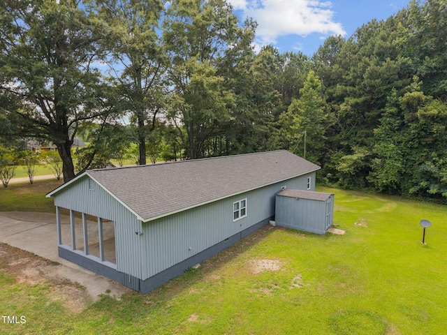7595 Clayton Blvd Unit B, Clayton, NC 27520 - view of home's exterior with a yard, roof with shingles, and an outdoor structure