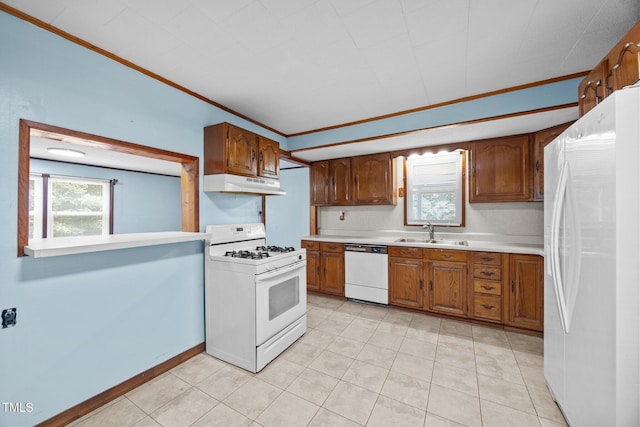 7595 Clayton Blvd Unit B, Clayton, NC 27520 - kitchen featuring white appliances, under cabinet range hood, light countertops, light tile patterned floors, and crown molding