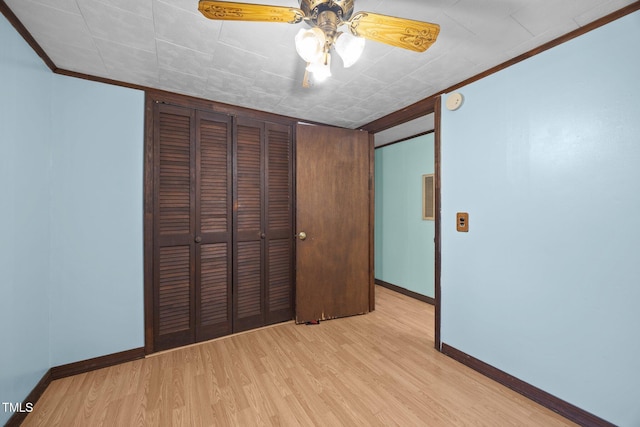7595 Clayton Blvd Unit B, Clayton, NC 27520 - unfurnished bedroom with ornamental molding, wood finished floors, a closet, and a ceiling fan
