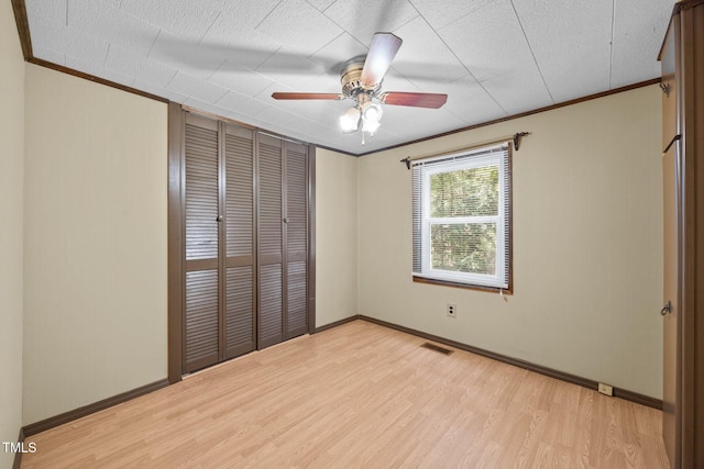 7595 Clayton Blvd Unit B, Clayton, NC 27520 - unfurnished bedroom with light wood-style floors, crown molding, a closet, and ceiling fan