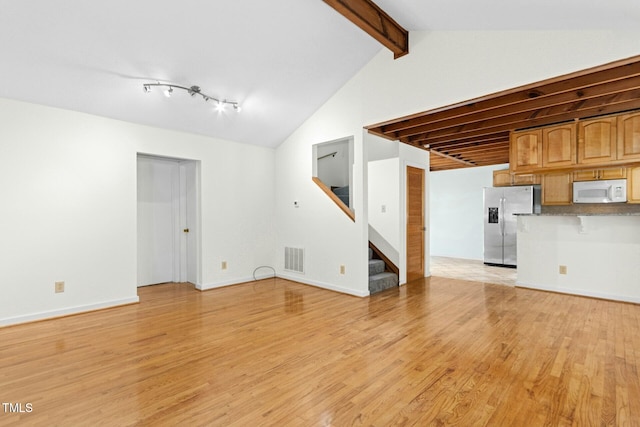 18 Frances St, Chapel Hill, NC 27517 - unfurnished living room featuring light wood finished floors and stairway