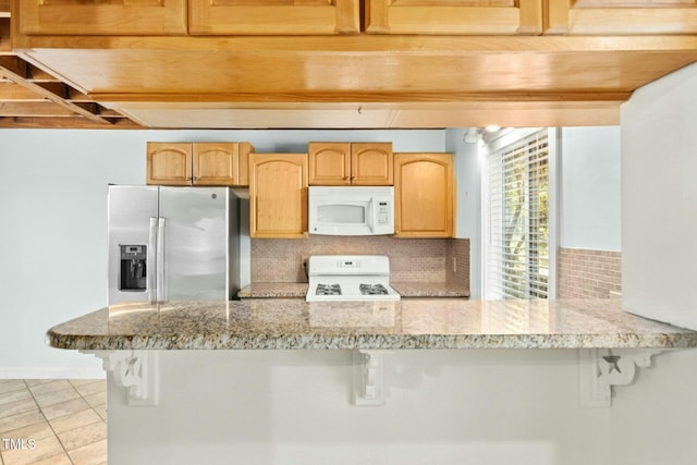 18 Frances St, Chapel Hill, NC 27517 - kitchen featuring white microwave, range, stainless steel fridge, a breakfast bar area, and decorative backsplash