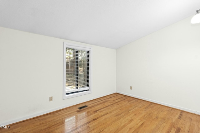 18 Frances St, Chapel Hill, NC 27517 - unfurnished room featuring wood finished floors and lofted ceiling