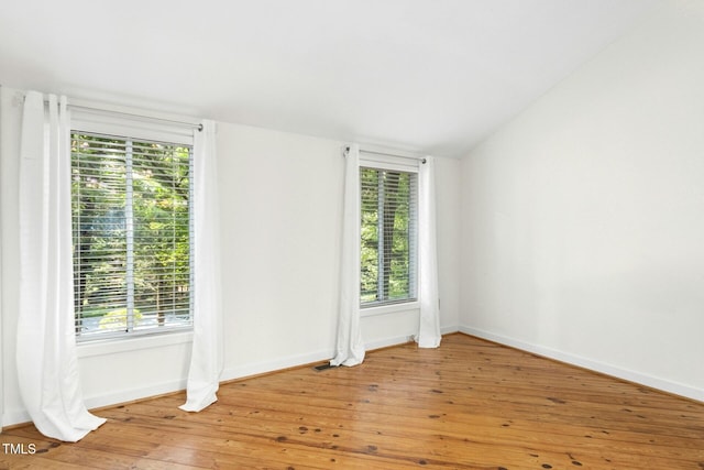 18 Frances St, Chapel Hill, NC 27517 - spare room with plenty of natural light, light wood-style flooring, and vaulted ceiling