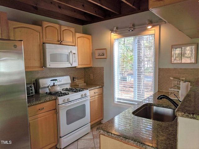 18 Frances St, Chapel Hill, NC 27517 - kitchen with white appliances, dark stone counters, plenty of natural light, and backsplash