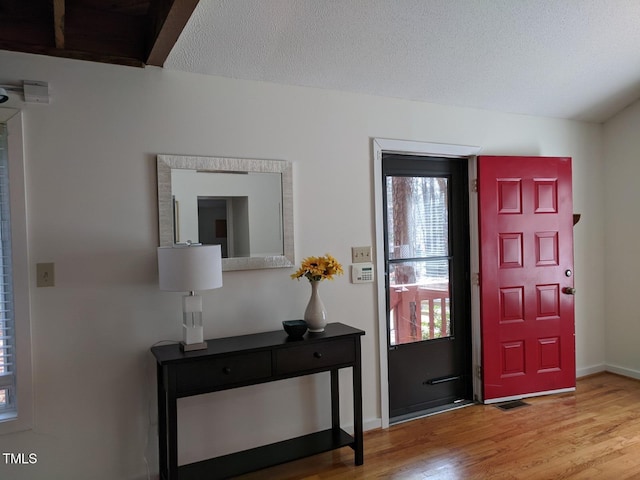 18 Frances St, Chapel Hill, NC 27517 - foyer entrance featuring wood finished floors and baseboards