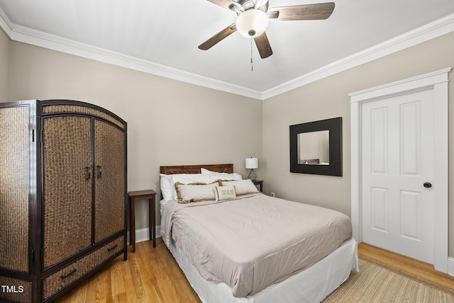 204 Edgepine Dr, Holly Springs, NC 27540 - bedroom with wood finished floors, ornamental molding, and a ceiling fan