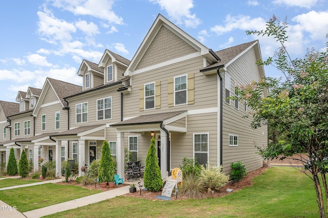 321 Conrad Ln, Wake Forest, NC 27587 - townhome / multi-family property with a front yard and roof with shingles