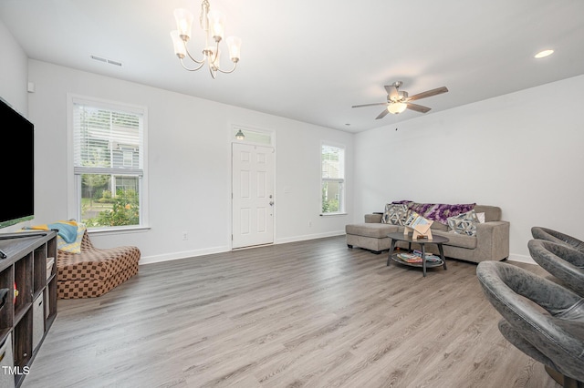 321 Conrad Ln, Wake Forest, NC 27587 - living room featuring wood finished floors, a chandelier, a ceiling fan, and recessed lighting