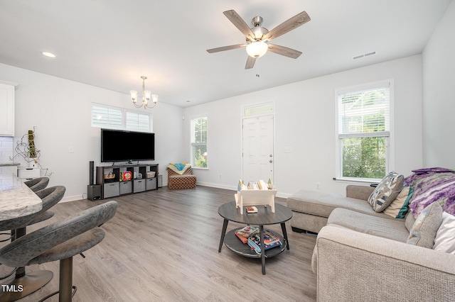 321 Conrad Ln, Wake Forest, NC 27587 - living area with healthy amount of natural light, a chandelier, light wood-style floors, a ceiling fan, and recessed lighting