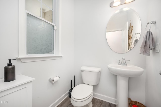 321 Conrad Ln, Wake Forest, NC 27587 - bathroom featuring baseboards and wood finished floors