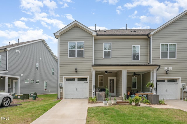 321 Conrad Ln, Wake Forest, NC 27587 - view of front of property featuring a garage, a front lawn, driveway, and a ceiling fan