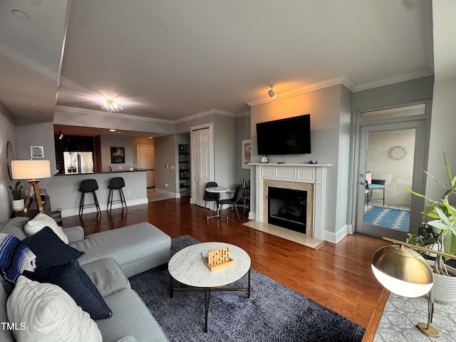 510 Glenwood Ave Unit 606, Raleigh, NC 27603 - living room with wood finished floors, a high end fireplace, and ornamental molding