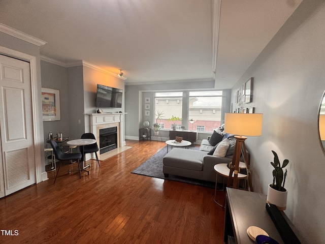 510 Glenwood Ave Unit 606, Raleigh, NC 27603 - living area featuring a fireplace with flush hearth, wood finished floors, and ornamental molding