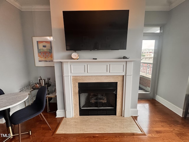 510 Glenwood Ave Unit 606, Raleigh, NC 27603 - detailed view of ornamental molding, wood finished floors, and a fireplace with flush hearth