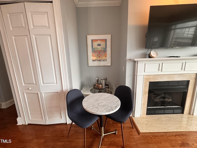 510 Glenwood Ave Unit 606, Raleigh, NC 27603 - dining space featuring ornamental molding, wood finished floors, and a fireplace
