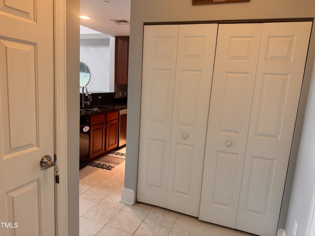 510 Glenwood Ave Unit 606, Raleigh, NC 27603 - hallway featuring light tile patterned flooring and a sink