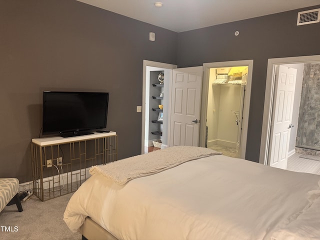 510 Glenwood Ave Unit 606, Raleigh, NC 27603 - bedroom featuring carpet flooring and a spacious closet