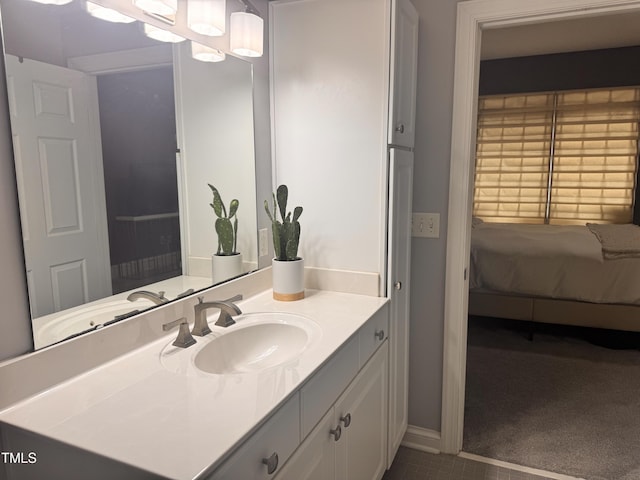 510 Glenwood Ave Unit 606, Raleigh, NC 27603 - bathroom with vanity, ensuite bathroom, and tile patterned flooring
