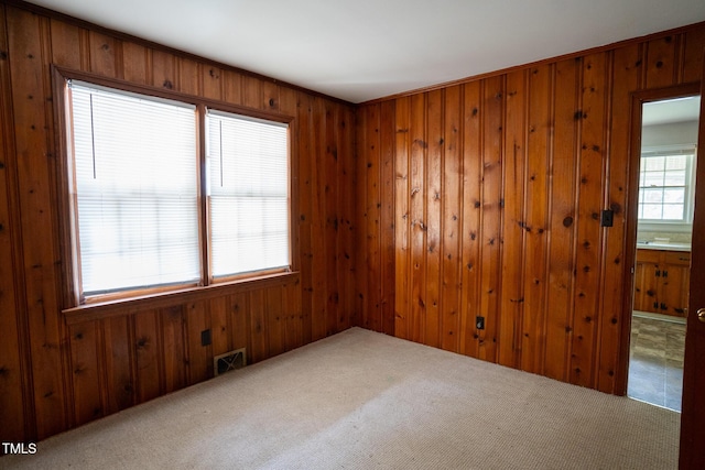 2100 Breeze Rd, Raleigh, NC 27608 - carpeted empty room with wood walls
