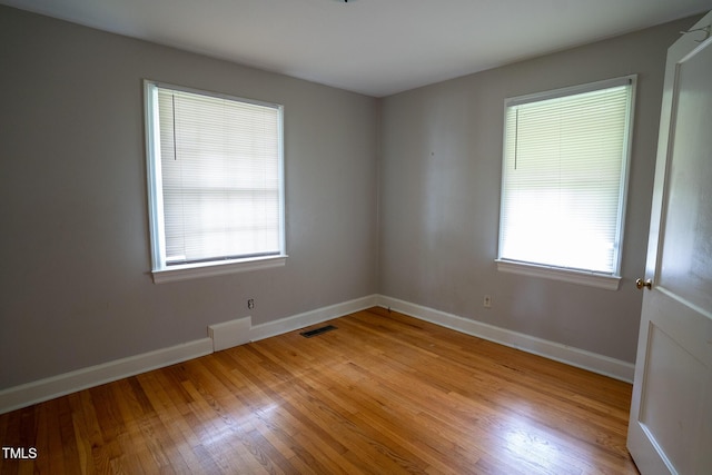 2100 Breeze Rd, Raleigh, NC 27608 - unfurnished room featuring plenty of natural light and light wood finished floors