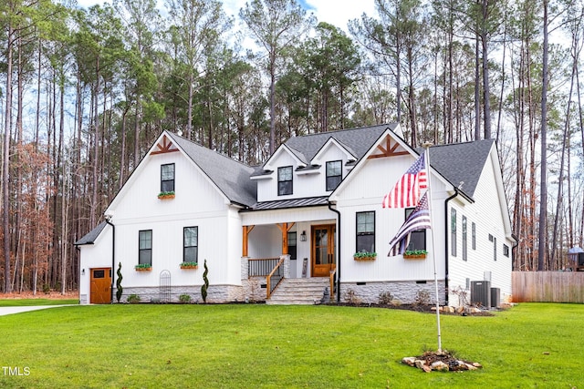 257 Rawhide Dr, Louisburg, NC 27549 - modern farmhouse style home featuring a standing seam roof, a metal roof, covered porch, concrete driveway, and an attached garage