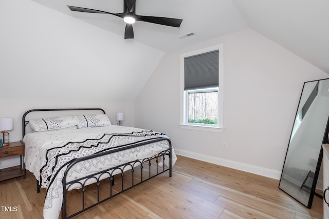 257 Rawhide Dr, Louisburg, NC 27549 - bedroom featuring vaulted ceiling, wood finished floors, and a ceiling fan