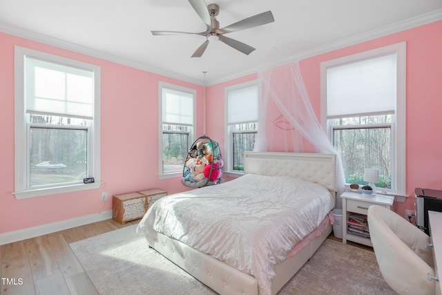 257 Rawhide Dr, Louisburg, NC 27549 - bedroom featuring crown molding, wood finished floors, and a ceiling fan