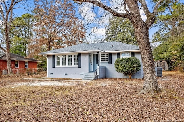 334 Richmond Dr, Fayetteville, NC 28304 - view of front of house featuring crawl space, a shingled roof, a shed, brick siding, and entry steps