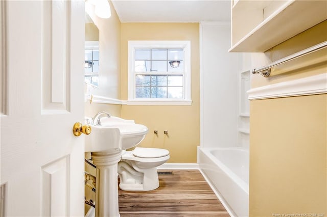334 Richmond Dr, Fayetteville, NC 28304 - bathroom featuring wood finished floors and bathtub / shower combination