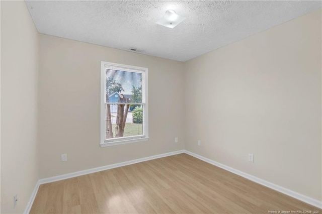 6324 Foxlake Dr, Fayetteville, NC 28314 - spare room featuring light wood finished floors and a textured ceiling