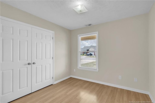 6324 Foxlake Dr, Fayetteville, NC 28314 - unfurnished bedroom with light wood-style floors and a closet