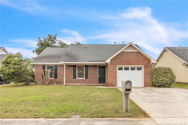 6324 Foxlake Dr, Fayetteville, NC 28314 - view of front facade with a garage, brick siding, and concrete driveway