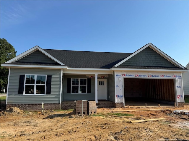 6301 Emerson Grove Ct, Stedman, NC 28391 - view of front of house with an attached garage and a porch