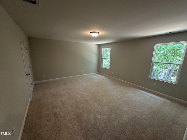 57 Blanton Ct, Lillington, NC 27546 - unfurnished room featuring baseboards and light carpet