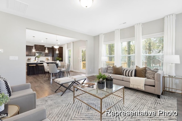 59 Curling Creek Dr Unit I285, Clayton, NC 27527 - living area with wood finished floors and plenty of natural light