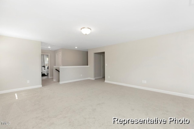 59 Curling Creek Dr Unit I285, Clayton, NC 27527 - unfurnished room with light colored carpet and attic access