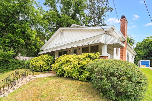 907 Morehead Ave, Durham, NC 27707 - view of front of home featuring a chimney and a front lawn