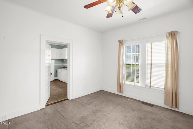 907 Morehead Ave, Durham, NC 27707 - empty room with carpet, ceiling fan, and ornamental molding