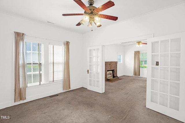 907 Morehead Ave, Durham, NC 27707 - unfurnished living room with a ceiling fan, carpet flooring, french doors, and a brick fireplace